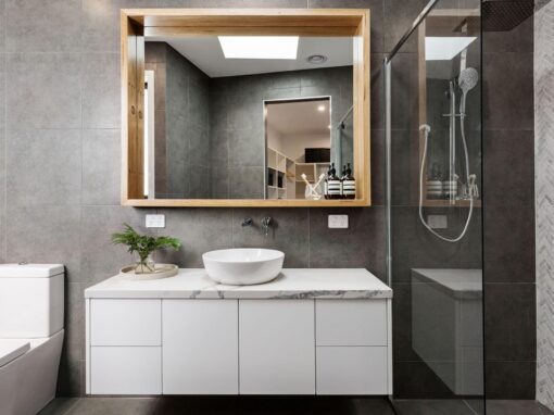 Contemporary bathroom with sleek vanity, walk-in shower, and stylish decor.