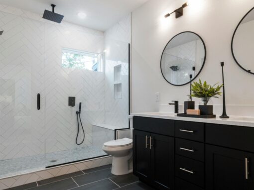 Contemporary bathroom with walk-in shower, black fixtures, and minimalist design.