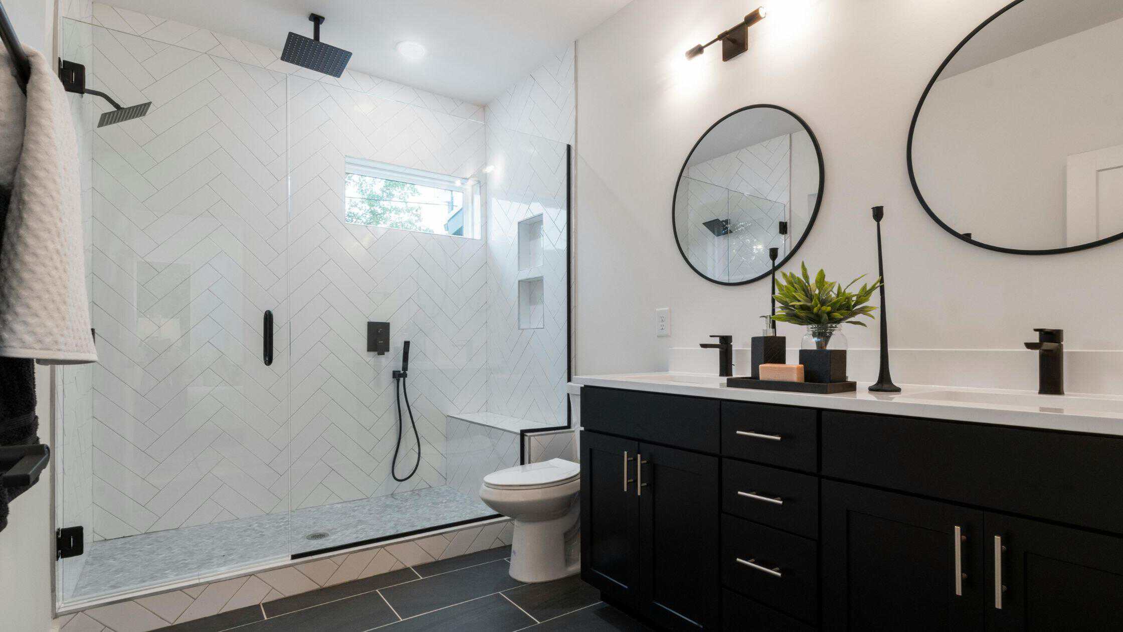 Modern Bathroom Shower Contemporary bathroom with walk-in shower, black fixtures, and minimalist design.